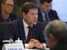 FILE - In this June 13, 2017, file photo, IOC Coordination Commission chairman Alexander Zhukov of Russia speaks during a plenary session of the second IOC Coordination Commission meeting with Beijing Organizing Committee for the 2022 Beijing Winter Olympic Games, at a hotel in Beijing. Zhukov tells The Associated Press he expects all of his country's athletes to be in South Korea for the Winter Olympics. (AP Photo/Andy Wong, File)