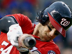 FILE - In this Aug. 6, 2017, file photo, Washington Nationals' Bryce Harper warms up during the first inning of a baseball game against the Chicago Cubs in Chicago. Harper could come off the disabled list and return to the Washington Nationals' lineup Monday night on Sept. 25 in the opener of a three-game series at Philadelphia. (AP Photo/Nam Y. Huh, File)