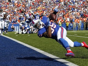 Buffalo Bills fullback Mike Tolbert drops a pass from quarterback Tyrod Taylor during the first half of an NFL football game against the Denver Broncos, Sunday, Sept. 24, 2017, in Orchard Park, N.Y. (AP Photo/Jeffrey T. Barnes)