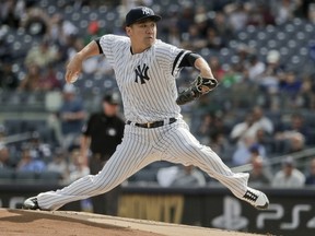 New York Yankees pitcher Masahiro Tanaka delivers against the Toronto Blue Jays during the first inning of a baseball game, Friday, Sept. 29, 2017 in New York. (AP Photo/Julie Jacobson)