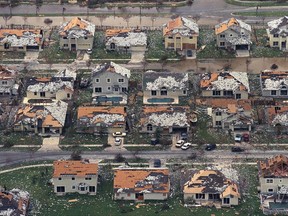 FILE - In this Aug. 25, 1992, file photo, rows of damaged houses sit between Homestead and Florida City, Fla., after Hurricane Andrew struck.  After a catastrophic Hurricane Andrew revealed how lax building codes had become in the country's most storm-prone state, Florida began requiring sturdier construction. Now, experts say a monstrously strong Hurricane Irma could become the most serious test of Florida's storm-worthiness since the 1992 disaster. (AP Photo/Mark Foley, File)