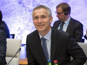 FILE- In this Sept. 7, 2017, file photo, NATO Secretary General Jens Stoltenberg smiles at the beginning of the informal meeting of the EU ministers of defence in Tallinn, Estonia. Stoltenberg said in an interview Tuesday, Sept. 19, with The Associated Press on the sidelines of the U.N. General Assembly's annual ministerial meeting that after many years of decline, "we have now seen for the first time since the end of the Cold War a real increase in defense spending across Europe and Canada." (AP Photo/Liis Treimann, File)