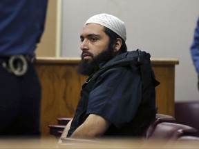 FILE - In this Dec. 20, 2016 file photo, Ahmad Khan Rahimi, the man accused of setting off bombs in New Jersey and New York's Chelsea neighborhood in September, sits in court in Elizabeth, N.J. Federal Judge Richard Berman told prospective jurors in New York City on Wednesday, Sept. 27, 2017, that the trial of Rahimi would last about two weeks. Opening statements are likely Monday. (AP Photo/Mel Evans, File)
