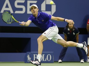Sam Querrey, of the United States, runs down a shot during the second-set tiebreak in a quarterfinal against Kevin Anderson, of South Africa, at the U.S. Open tennis tournament in New York, Tuesday, Sept. 5, 2017. (AP Photo/Kathy Willens)