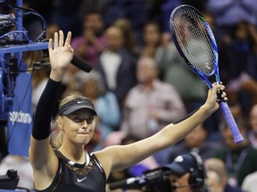 Mari Sharapova, of Russia, waves to the crowd after defeating Sofia Kenin, of the United States, 7-5, 6-2 at the U.S. Open tennis tournament in New York, Friday, Sept. 1, 2017. (AP Photo/Kathy Willens)