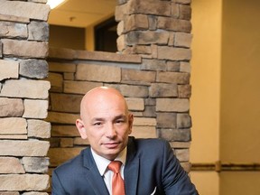 This April 5, 2016 photo shows Anthony Melchiorri, the star of Travel Channel's "Hotel Impossible," at the Big Bear Motel in Cody , Wyo. Melchiorri is entering his seventh season as the hotel fixer on "Hotel Impossible," and is as passionate as ever about perfecting standards in the hospitality industry. (Taylor Glenn/Travel Channel via AP)