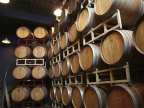 This undated image provided by Finger Lakes Tourism shows wine barrels at Heron Hill Winery in Hammondsport, N.Y., in the Finger Lakes region. The area is known for wineries and scenic countryside around 11 long, narrow lakes in central New York, about 250 miles northwest of New York City. Fall is a popular time of year to visit thanks to the harvest season and autumn foliage. (Finger Lakes Tourism via AP)