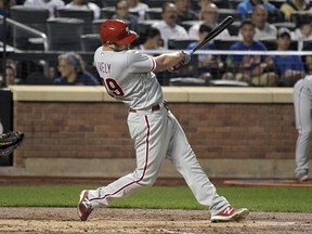 Philadelphia Phillies' Ben Lively hits a two-RBI single during the second inning of a baseball game against the Philadelphia Phillies, Tuesday, Sept. 5, 2017, at Citi Field in New York. (AP Photo/Bill Kostroun)