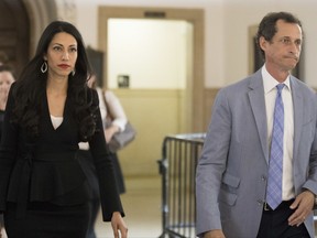 Former congressman Anthony Weiner, right, and his estranged wife, Huma Abedin leave court after appearing before a judge to ask for privacy in their divorce case, Wednesday, Sept. 13, 2017, in New York. Abedin was a top aide to Democrat Hillary Clinton and split with Weiner after he repeatedly sent sexually explicit material to other women.