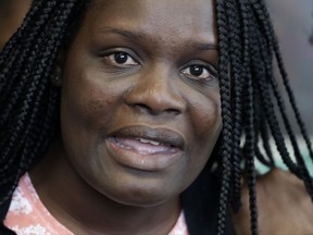 Louna Dennis, the mother of Matthew McCree, holds a news conference at her attorney's office, Friday, Sept. 29, 2017, in the Brooklyn borough of New York. Fifteen-year-old McCree was stabbed to death in his Bronx high school history class by Abel Cedeno on Wednesday. (AP Photo/Mark Lennihan)