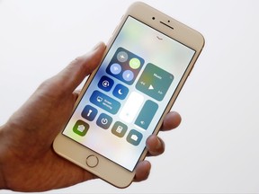 In this Sept. 15, 2017, photo, the iOS 11 control center is displayed on the iPhone 8 Plus in New York. The control center offers easy access to the flashlight and other tools with a swipe up from the bottom. It got separated into multiple pages last year to increase the options available, but the extra swipes got annoying. With iOS 11, it's back to a single page. (AP Photo/Mark Lennihan)
