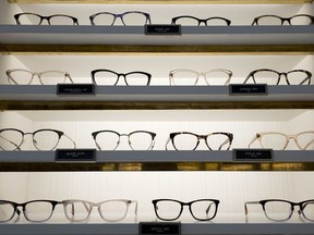 Warby Parker eyewear is displayed at a company retail store, Wednesday, Sept. 6, 2017, in New York. At Warby Parker, you can pick out five frames to try for five days for free. (AP Photo/Mark Lennihan)