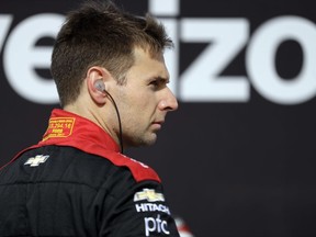 Will Power waits in his pit box before practice for Sunday's IndyCar Series auto race, Friday, Sept. 1, 2017, in Watkins Glen, N.Y. (AP Photo/Matt Slocum)
