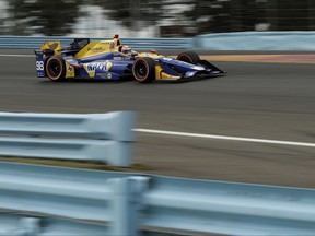 Alexander Rossi drives through Turn 1 during qualifying for Sunday's IndyCar Series auto race, Saturday, Sept. 2, 2017, in Watkins Glen, N.Y. (AP Photo/Matt Slocum)