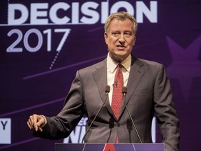 FILE - In this Aug. 23, 2017, file photo, New York City Mayor Bill de Blasio participates in the first debate for the Democratic mayoral primary in New York. De Blasio faces a crowded primary field, but no challengers with his organizing power or financial muscle, as he seeks a second term as the leader of the country's largest city. He is one of five Democrats running in the primary Tuesday, Sept. 12. (Sam Hodgson/The New York Times via AP, Pool, File)