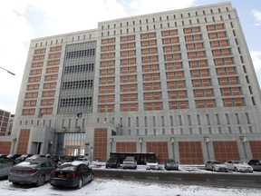 FILE - In this Jan. 8, 2017 file photo, the Metropolitan Detention Center (MDC) is shown in the Brooklyn borough of New York. Inmate No. 87850-053 has no internet. That could be the least of the inconveniences ahead for "Pharma Bro" Martin Shkreli, whose online rantings prompted a judge this week to revoke his bail and put him in the Metropolitan Detention Center, a fortress-like federal jail that also houses alleged terrorists and mobsters. (AP Photo/Kathy Willens, File)