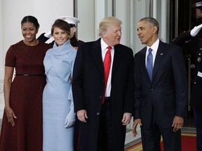 FILE - In a Friday, Jan. 20, 2017 file photo, President Barack Obama and first lady Michelle Obama pose with President-elect Donald Trump and his wife Melania at the White House in Washington. Before he left office in January, President Barack Obama offered his successor accolades and advice in a private letter that underscored some of his concerns as he passed the baton.  In the letter, published Sunday, Sept. 3, 2017, by CNN, Obama urged President Donald Trump to "build more ladders of success for every child and family," to "sustain the international order" and to protect "democratic institutions and traditions."(AP Photo/Evan Vucci, File)