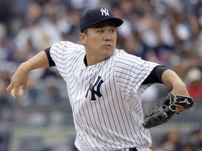 New York Yankees pitcher Masahiro Tanaka delivers the ball to the Boston Red Sox during the first inning of a baseball game Saturday, Sept.2, 2017, at Yankee Stadium in New York. (AP Photo/Bill Kostroun)