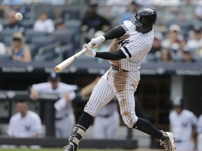 New York Yankees' Didi Gregorius hits a solo home run during the second inning of a baseball game against the Baltimore Orioles at Yankee Stadium, Sunday, Sept. 17, 2017, in New York. (AP Photo/Seth Wenig)