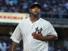 New York Yankees pitcher C. C. Sabathia walks to the dugout after striking out a Boston Red Sox batter to end the top of the first inning of a baseball game Thursday, Aug. 31, 2017, in New York. (AP Photo/Craig Ruttle)