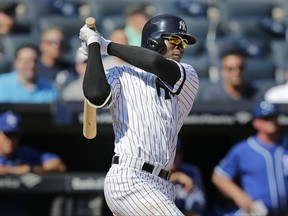 New York Yankees' Didi Gregorius watches his RBI ground-out during the first inning of a baseball game against the Kansas City Royals at Yankee Stadium, Monday, Sept. 25, 2017, in New York. (AP Photo/Seth Wenig)
