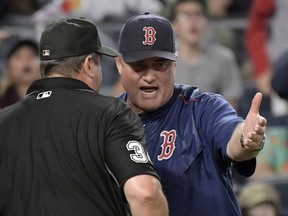 Boston Red Sox manager John Farrell talks with home plate umpire Sam Holbrook during the sixth inning of a baseball game against the New York Yankees, Sunday, Sept. 3, 2017, at Yankee Stadium in New York. (AP Photo/Bill Kostroun)