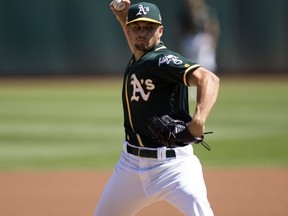 Oakland Athletics starting pitcher Kendall Graveman delivers against the Houston Astros during the first inning of a baseball game, Sunday, Sept. 10, 2017, in Oakland, Calif. (AP Photo/D. Ross Cameron)