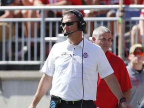 Ohio State head coach Urban Meyer watches from the sideline against UNLV during the first half of an NCAA college football game Saturday, Sept. 23, 2017, in Columbus, Ohio. (AP Photo/Jay LaPrete)