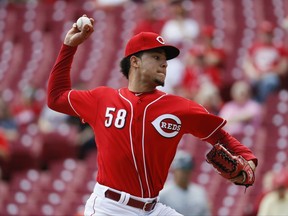 Cincinnati Reds starting pitcher Luis Castillo throws in the first inning of a baseball game against the Milwaukee Brewers, Wednesday, Sept. 6, 2017, in Cincinnati. (AP Photo/John Minchillo)