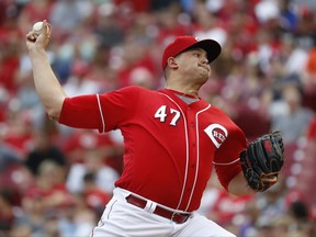 Cincinnati Reds starting pitcher Sal Romano throws in the first inning of a baseball game against the Pittsburgh Pirates, Saturday, Sept. 16, 2017, in Cincinnati. (AP Photo/John Minchillo)