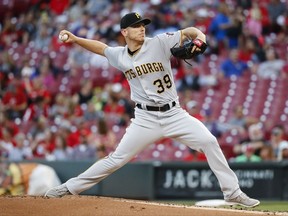 Pittsburgh Pirates starting pitcher Chad Kuhl throws during the first inning of a baseball game against the Cincinnati Reds, Friday, Sept. 15, 2017, in Cincinnati. (AP Photo/John Minchillo)