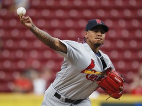 St. Louis Cardinals starting pitcher Carlos Martinez throws during the first inning of a baseball game against the Cincinnati Reds, Thursday, Sept. 21, 2017, in Cincinnati. (AP Photo/John Minchillo)