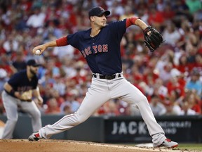 Boston Red Sox starting pitcher Rick Porcello throws during the first inning of a baseball game against the Cincinnati Reds, Friday, Sept. 22, 2017, in Cincinnati. (AP Photo/John Minchillo)