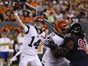 Cincinnati Bengals quarterback Andy Dalton (14) throws a pass during the first half of an NFL football game against the Houston Texans, Thursday, Sept. 14, 2017, in Cincinnati. (AP Photo/Frank Victores)
