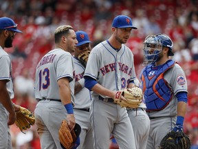 New York Mets relief pitcher Jerry Blevins (39) is relieved in the eighth inning of a baseball game against the Cincinnati Reds, Thursday, Aug. 31, 2017, in Cincinnati. The Reds won 7-2. (AP Photo/John Minchillo)