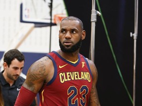 Cleveland Cavaliers' LeBron James walks through the NBA basketball team media day, Monday, Sept. 25, 2017, in Independence, Ohio. (AP Photo/Ron Schwane)
