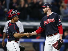 Cleveland Indians relief pitcher Zach McAllister, right, and Francisco Mejia celebrate a 11-0 victory over the Detroit Tigers in a baseball game, Monday, Sept. 11, 2017, in Cleveland. (AP Photo/Ron Schwane)