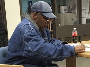O.J. Simpson signs documents before leaving Lovelock Correctional Centre in Lovelock, Nevada, early on October 1, 2017.