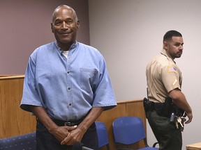 In this July 20, 2017, file photo, former NFL football star O.J. Simpson enters for his parole hearing at the Lovelock Correctional Center in Lovelock, Nev.