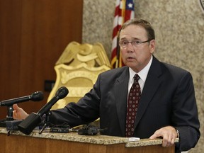 FILE - In this Wednesday, June 15, 2016 file photo, Oklahoma City Police Chief Bill Citty speaks during a news conference in Oklahoma City. 2016. Citty says he plans to meet with advocates for the hearing and speech-impaired following the fatal shooting of a deaf man. (AP Photo/Sue Ogrocki, File)