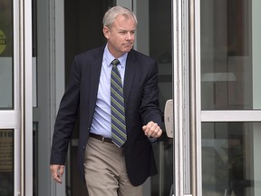 Dennis Oland heads from Court of Queen's Bench in Saint John, N.B. on Tuesday, Sept. 5, 2017 after a hearing to set a date for his new second-degree murder trial.