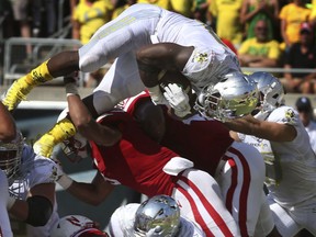 Oregon running back Royce Freeman leaps into the end zone for a second quarter score against Nebraska in an NCAA college football game Saturday, Sept. 9, 2017, in Eugene, Ore. (AP Photo/Chris Pietsch)
