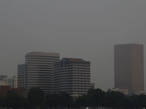The downtown skyline is visible through hazy smoke from wildfires in Portland, Ore., Tuesday, Sept. 5, 2017.  The dozens of fires burning across the Western United States and Canada have blanketed the air with choking smoke from Oregon to Colorado, where health officials issued an air quality advisory alert. (AP Photo/Don Ryan)