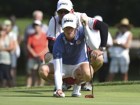 Stacy Lewis lines up her putt on the third hole during the final round of the Cambia Portland Classic golf tournament in Portland, Ore., Sunday, Sept. 3, 2017. (AP Photo/Steve Dykes)