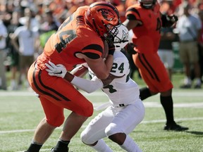Oregon State's Ryan Nall runs into Portland State's Artuz Manning after scoring a touchdown in the first half of an NCAA college football game, in Corvallis, Ore., Saturday, Sept. 2, 2017. (AP Photo/Timothy J. Gonzalez)
