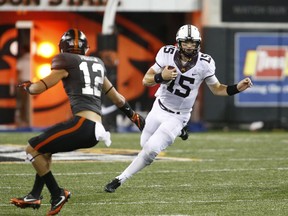 Minnesota quarterback Conor Rhoda (15) tries to get past Oregon State's David Morris during the second half of an NCAA college football game, in Corvallis, Ore., Saturday, Sept. 9, 2017. Minnesota won 48-14. (AP Photo/Timothy J. Gonzalez)