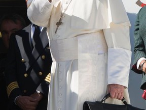 Pope Francos waves as he boards the plane for his five-day trip to Colombia, at Rome's Leonardo da Vinci international airport in Fiumicino, Wednesday, Sept. 6, 2017. Francis is heading to Colombia on Wednesday to try to help heal the wounds of Latin America's longest-running conflict, bolstered by a new cease-fire with a holdout rebel group but fully aware of the fragility of the country's peace process. Francis is heading to Colombia on Wednesday for a five-day visit to try to help heal the wounds of Latin America's longest-running conflict, bolstered by a new cease-fire with a holdout rebel group but fully aware of the fragility of the country's peace process. (L'Osservatore Romano/Pool Photo via AP)