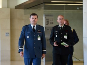 Lt. Gen. Pierre St-Amand, left, arrives to appear as a witness at a commons national defence committee in Ottawa on Thursday, Sept. 14, 2017. The committee is hearing witnesses on Canada's abilities to defend itself and our allies in the event of an attack by North Korea on the North American continent. THE CANADIAN PRESS/Sean Kilpatrick