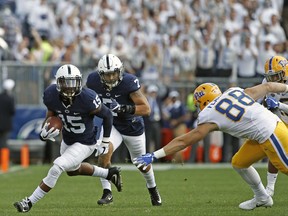 Penn State's Grant Haley (15) looks for running room after an interception against Pittsburgh during the first half of an NCAA college football game in State College, Pa., Saturday, Sept. 9, 2017. (AP Photo/Chris Knight)