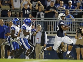 Penn State's Saquon Barkley (26) runs in for a touchdown after a catch against Georgia State during the first half of an NCAA college football game in State College, Pa., Saturday, Sept. 16, 2017. (AP Photo/Chris Knight)